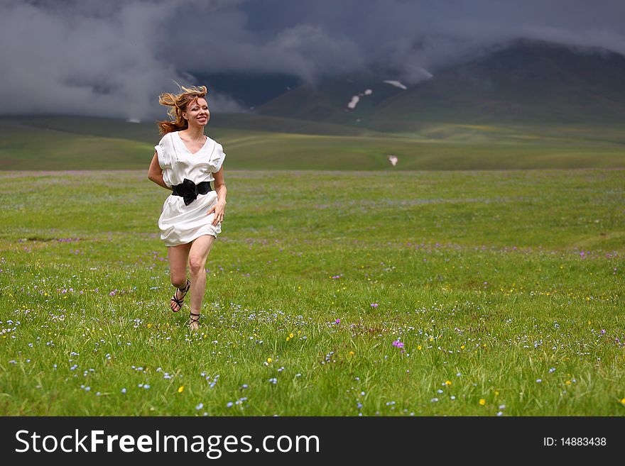 Girl in white dress in the mountains. Girl in white dress in the mountains