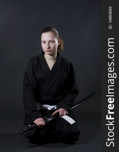 Portrait of female samurai holding katana