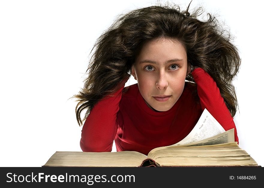 Girl in red cloth with big old book. Here hair is curl. Here hair is flying and shine. She rested his head with his hands. She look at the camera. Girl in red cloth with big old book. Here hair is curl. Here hair is flying and shine. She rested his head with his hands. She look at the camera.