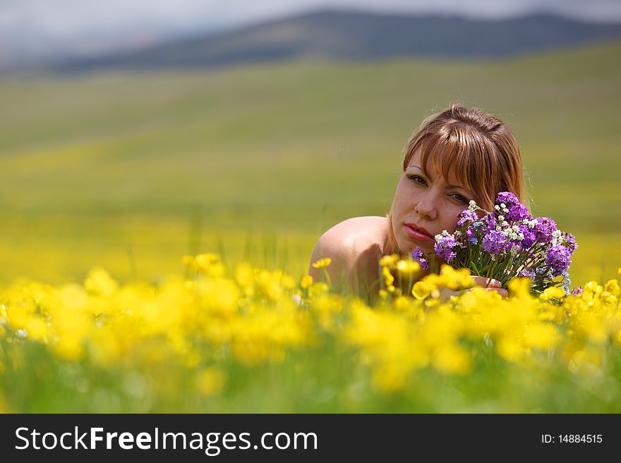 The girl with a bunch of flowers