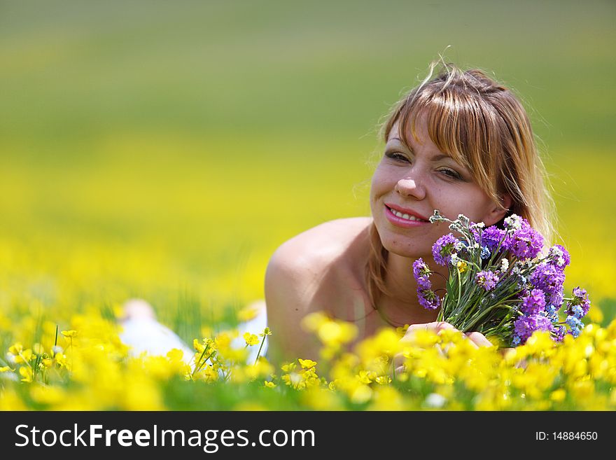 The girl with a bunch of flowers