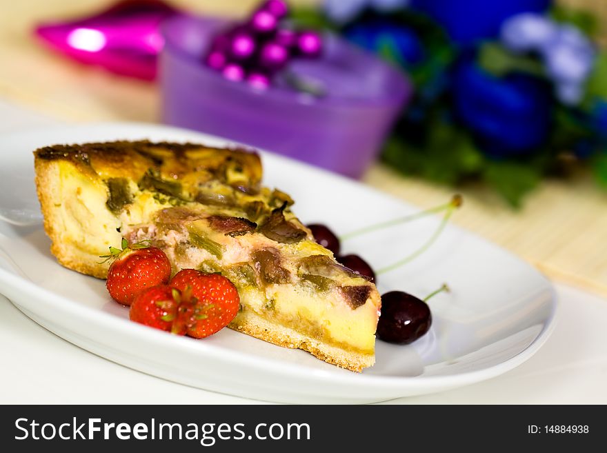 Fresh rhubarb cake with strawberry and cherry