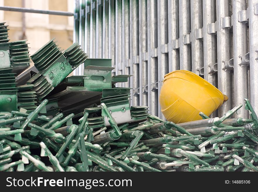 Block of scaffold and yellow helmet