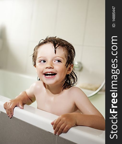 Bath time - little girl (3 years) bathing in bathroom