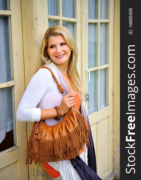 Beautiful Woman Standing Near A House