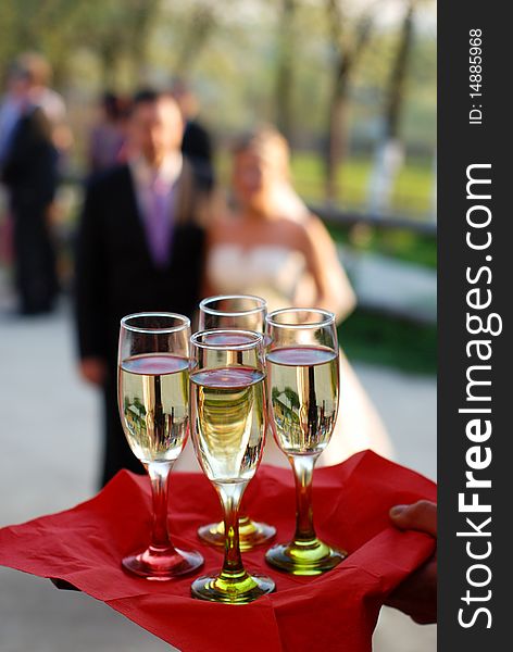 Glasses, bride and groom at the restaurant. Glasses, bride and groom at the restaurant.