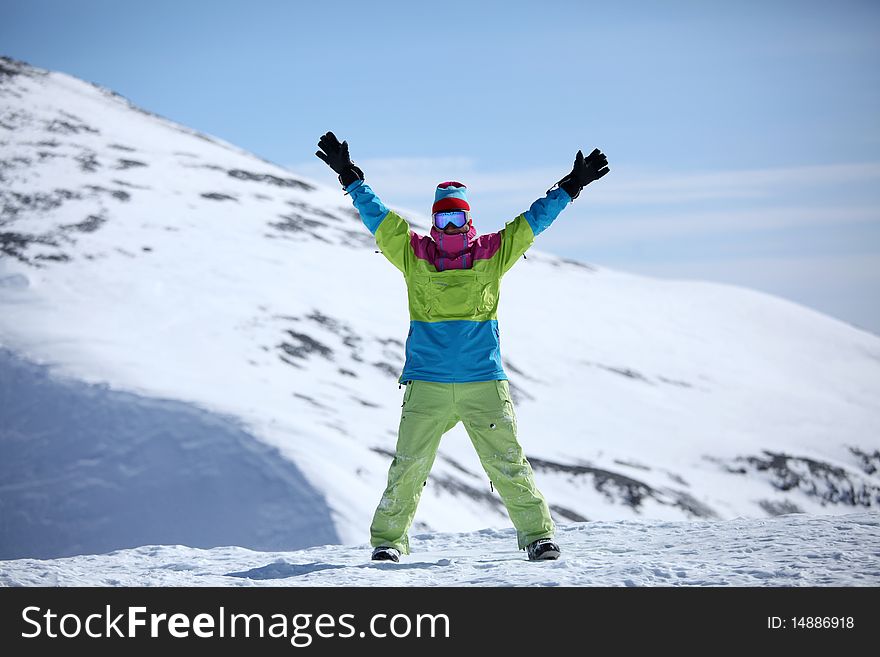 Snowboarder on top of the mountain. Snowboarder on top of the mountain