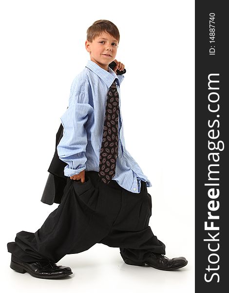 Adorable seven year old american boy in over sized suit. Adorable seven year old american boy in over sized suit.