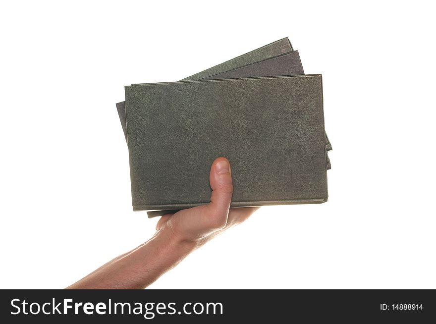 Hand with books isolated over white