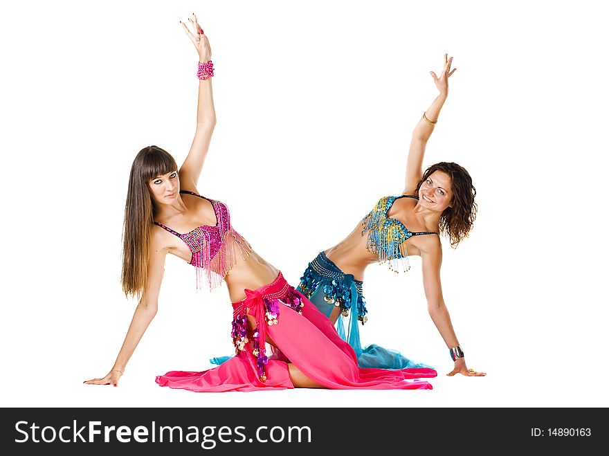 Two young Belly dancers posing sitting on the floor