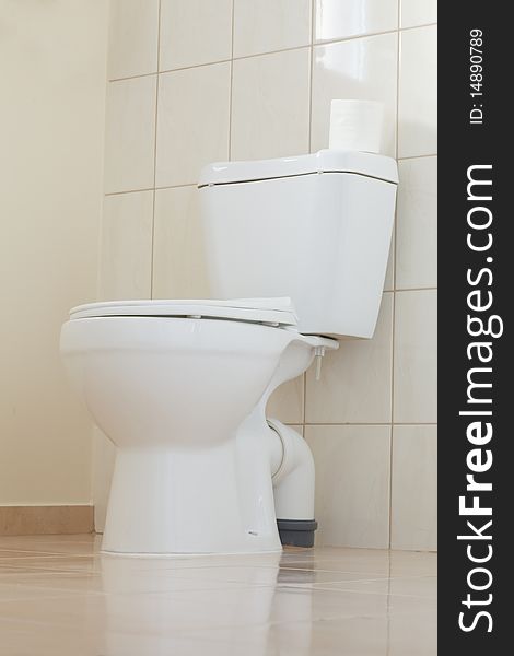 Clean and white toilet in a bathroom