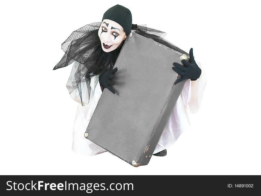 Sitting black and white pierrot with grey suitcase in hands overwhite. Sitting black and white pierrot with grey suitcase in hands overwhite