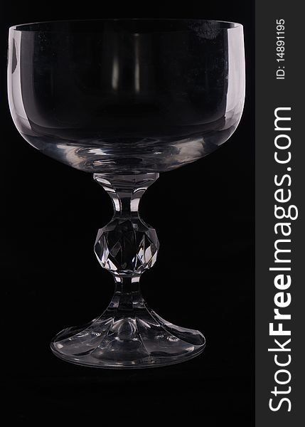 Low key shot of a wine glass against a black background