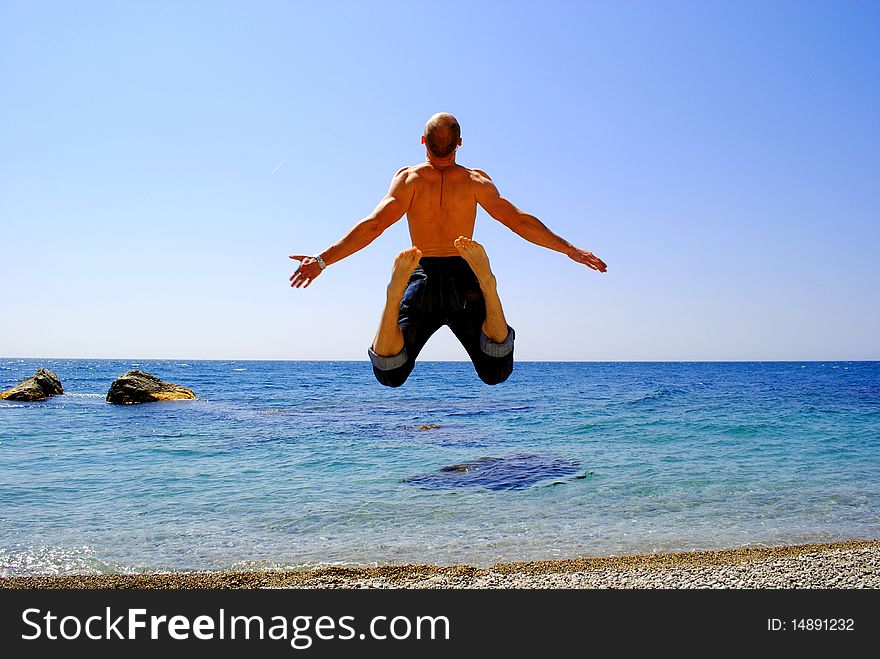 Man is jumping on the beach. Man is jumping on the beach