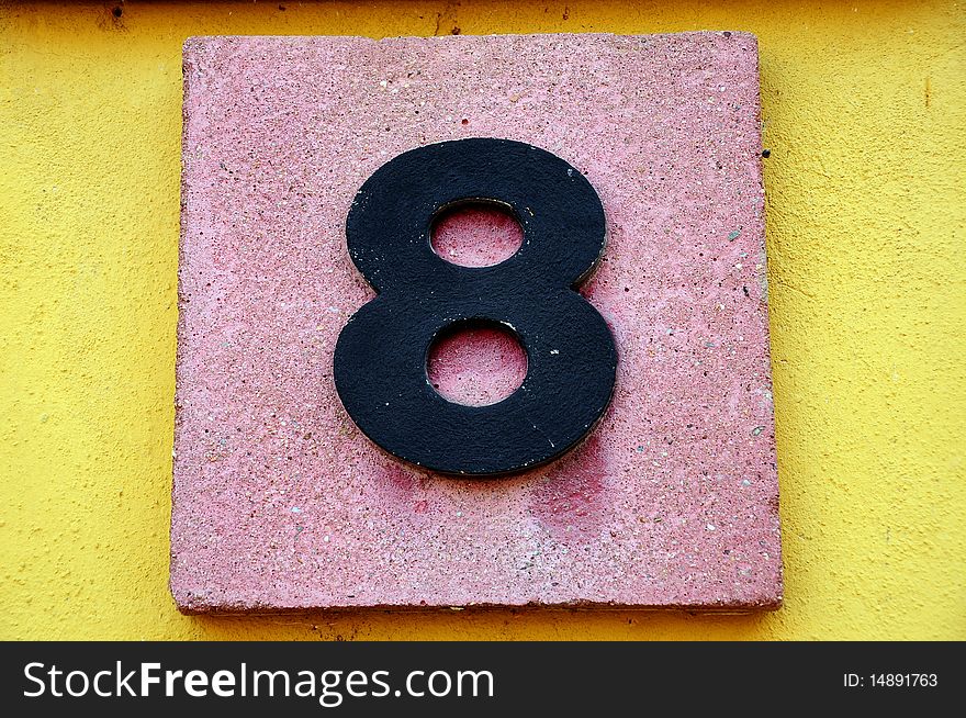 Number eight on a stone board