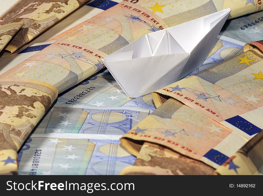 Paper Boat On Money