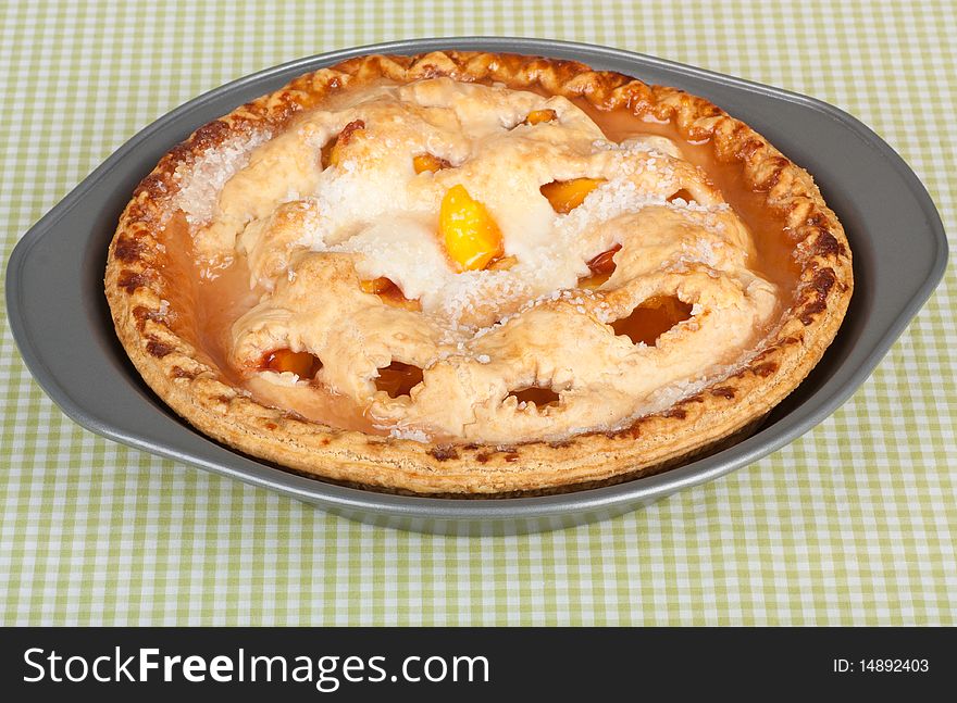 Baked peach pie in a pie pan