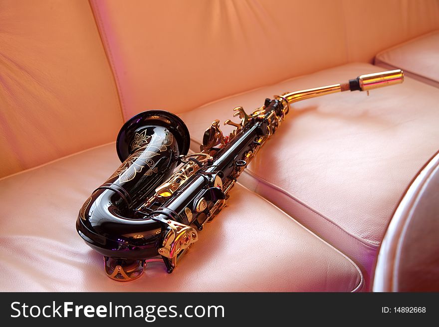 Saxophone lying on the sofa