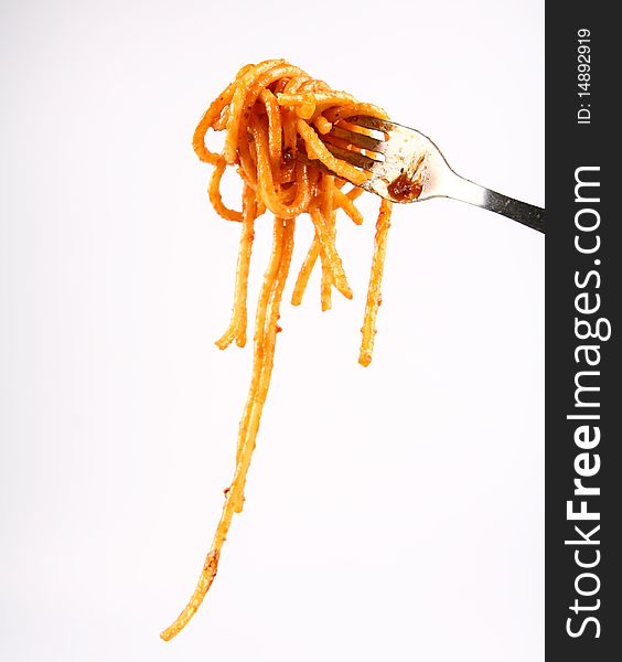 Spaghetti with sauce bolognese hanging on a fork. Spaghetti with sauce bolognese hanging on a fork