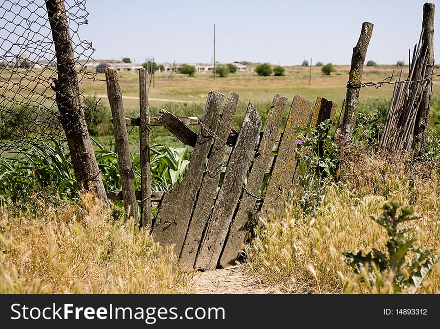 Old Wooden Fence On The Thrown Farm