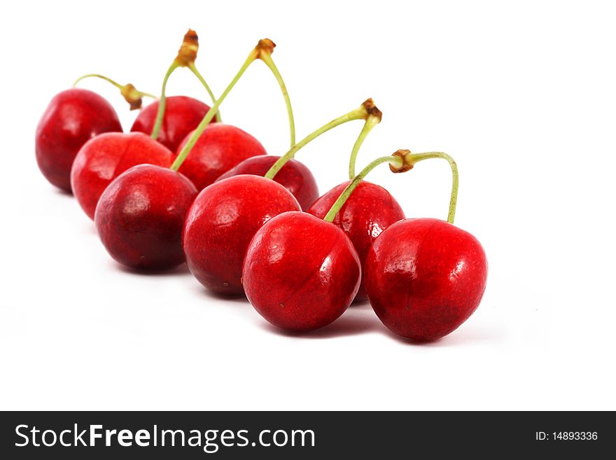 Ripe berries of a sweet cherry  on a white background. Ripe berries of a sweet cherry  on a white background