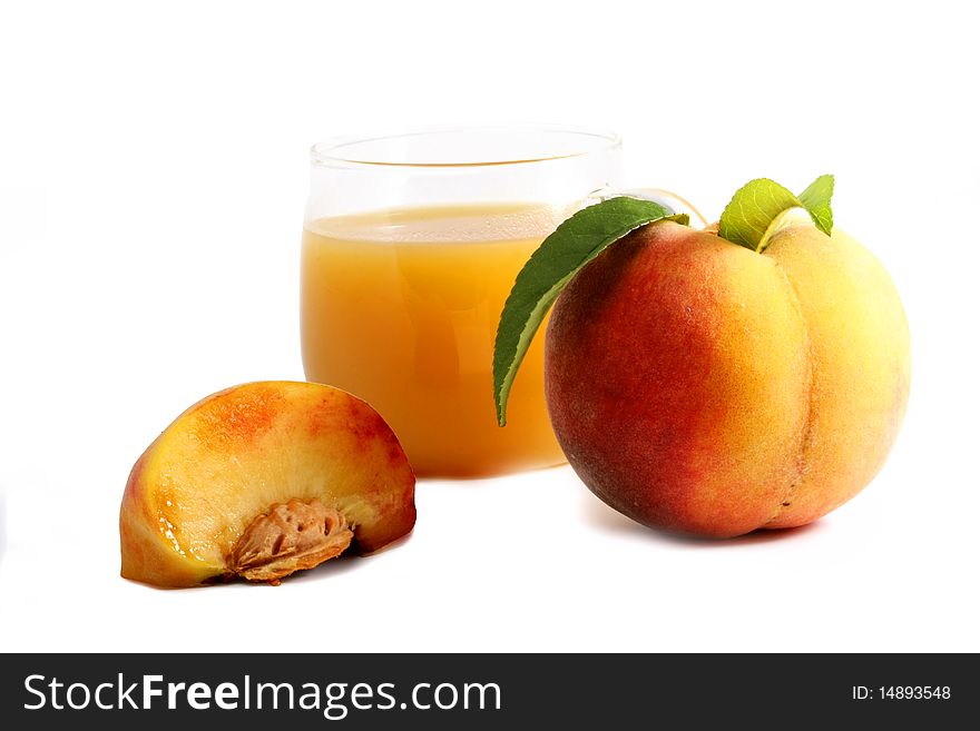 Ripe peach and fresh in a glass on a white background