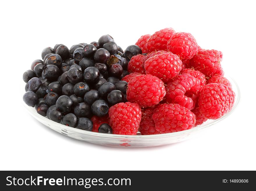 The berries raspberries and blueberries on white background