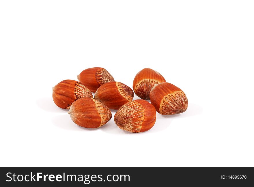 Hazelnuts hazelnuts on a secluded white. Hazelnuts hazelnuts on a secluded white