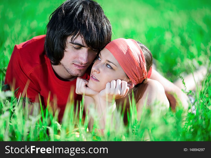 Nice girl in kerchief and boy on grass. Nice girl in kerchief and boy on grass