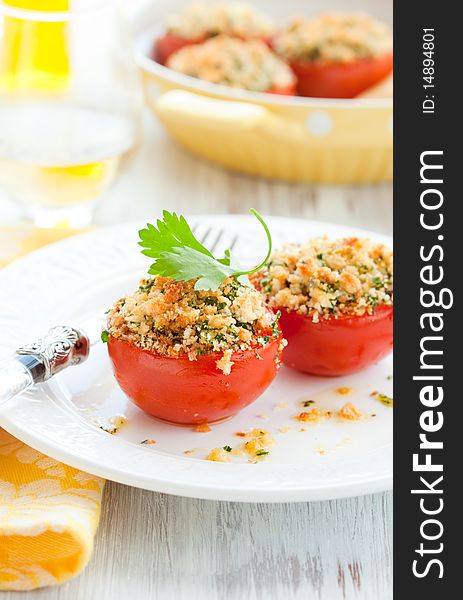 Provencal style baked tomatoes on the plate. Provencal style baked tomatoes on the plate