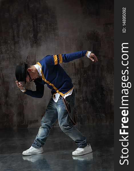 Modern style dancer posing on studio background. Modern style dancer posing on studio background