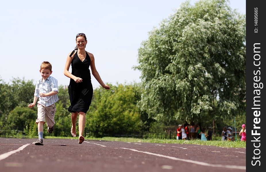 Happy mother and her little son outdoors session. Happy mother and her little son outdoors session