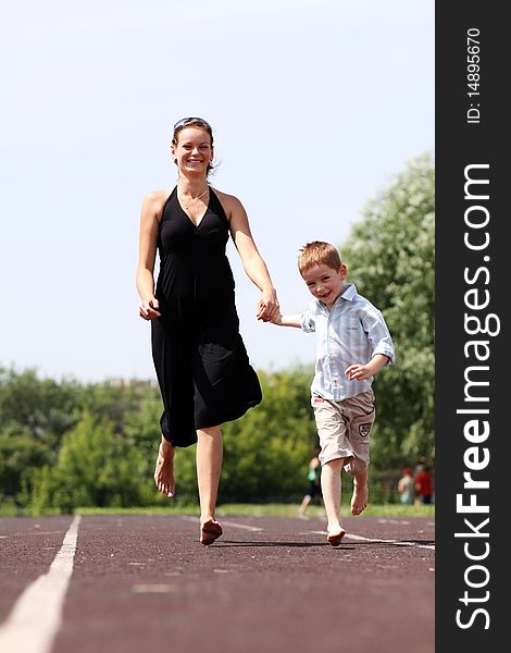 Happy mother and her little son outdoors session. Happy mother and her little son outdoors session