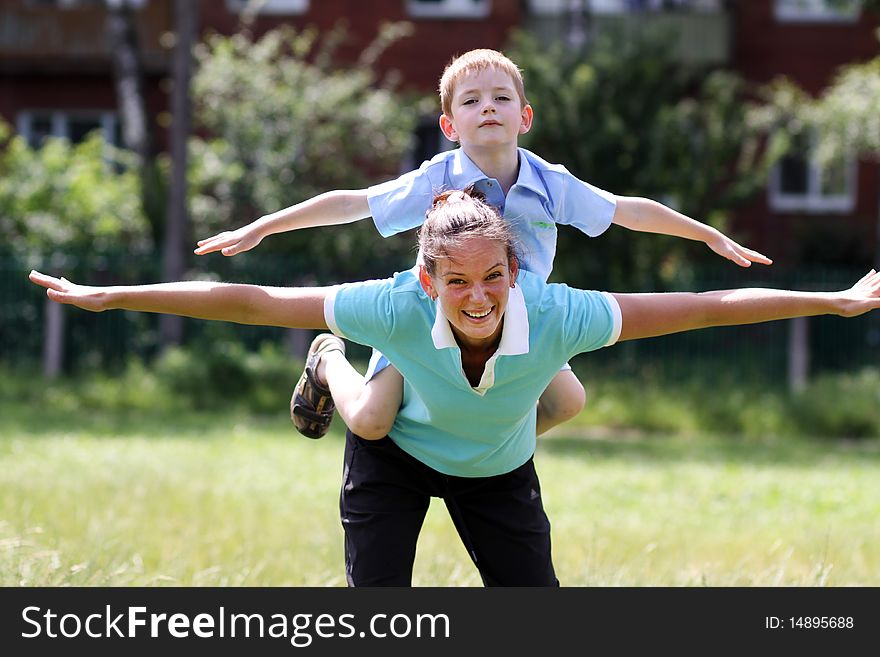 Happy mother and her little son outdoors session