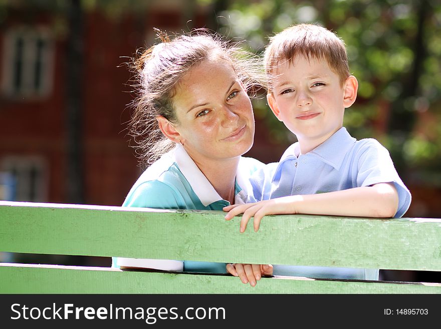 Happy mother and her little son outdoors session