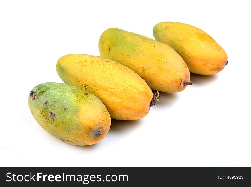 Ripe mangoes isolated over white background.