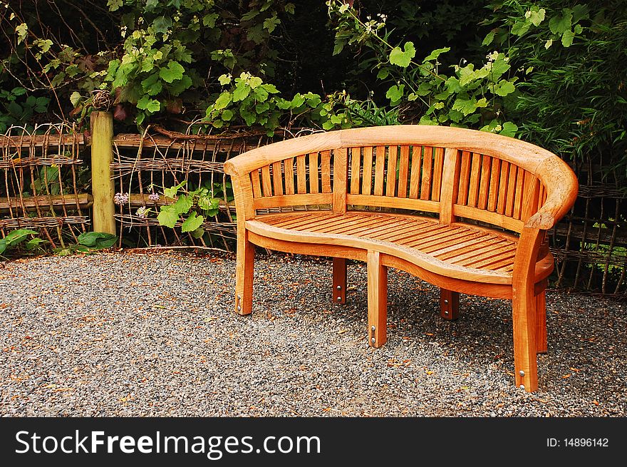 Wooden garden bench in pacific northwest garden