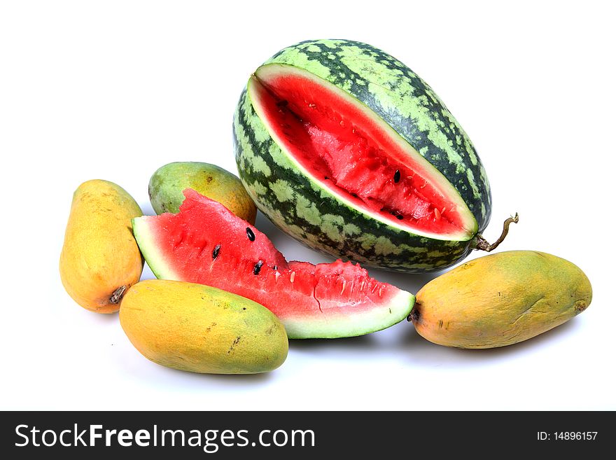 Fresh watermelon and mangoes isolated over white background. Fresh watermelon and mangoes isolated over white background.