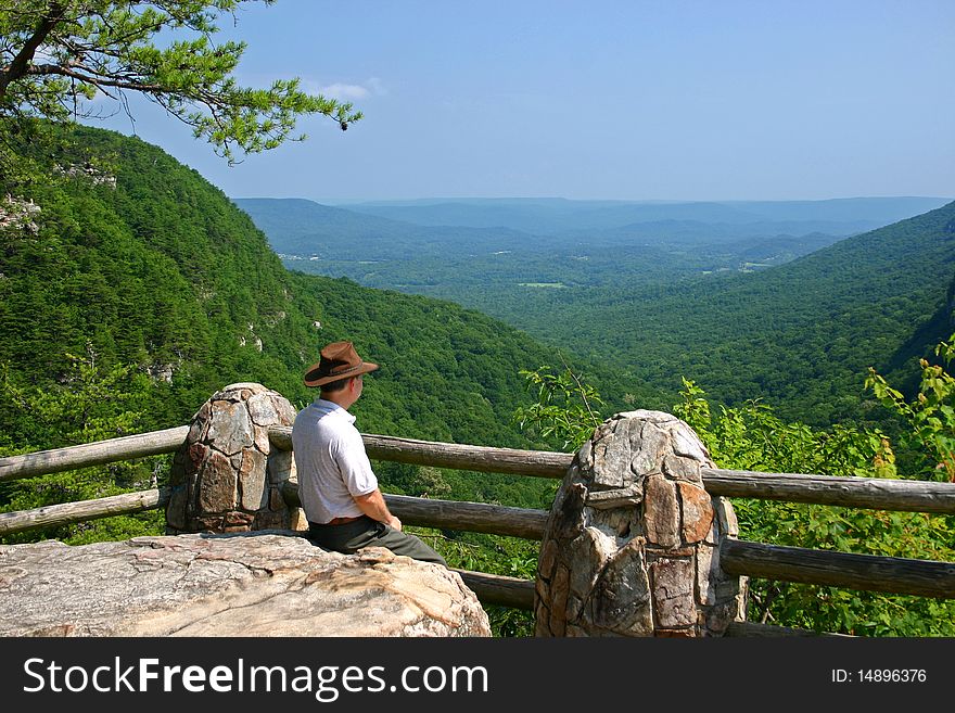 A hiker gazes at the view of Lookout Valley, from Cloudland Canyon State Park in Georgia. A hiker gazes at the view of Lookout Valley, from Cloudland Canyon State Park in Georgia