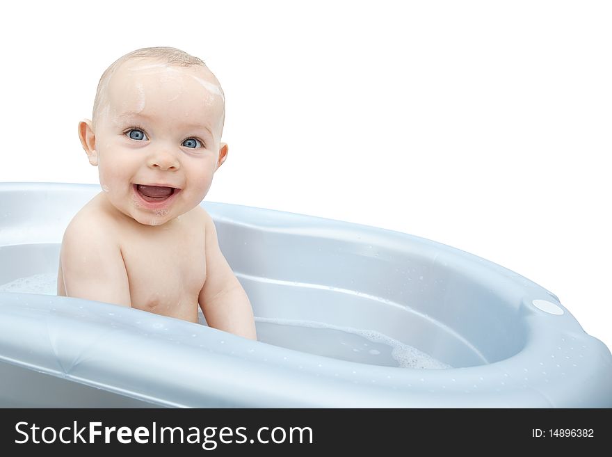 Smiling wet baby in a blue bathtub. Smiling wet baby in a blue bathtub.
