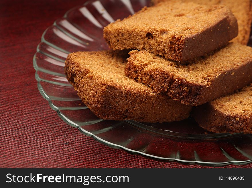 Slices of chocolate plum cake in a glass plate. Slices of chocolate plum cake in a glass plate