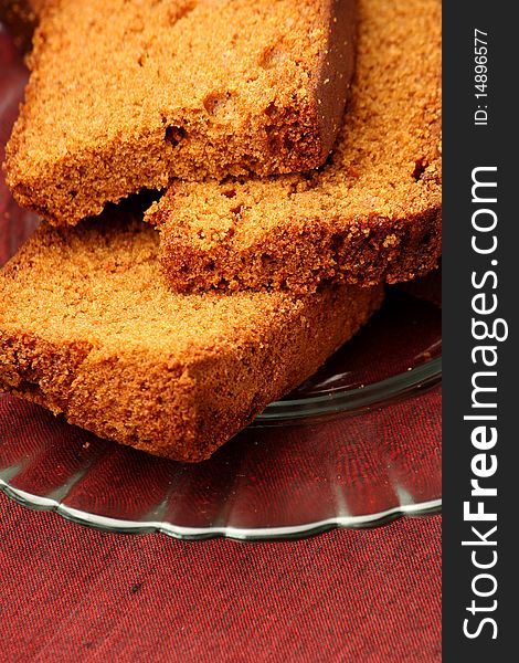 Slices of chocolate plum cake in a glass plate. Slices of chocolate plum cake in a glass plate