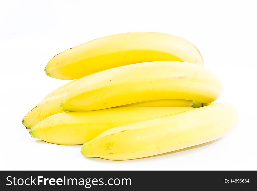Several yellow bananas isolated on white background