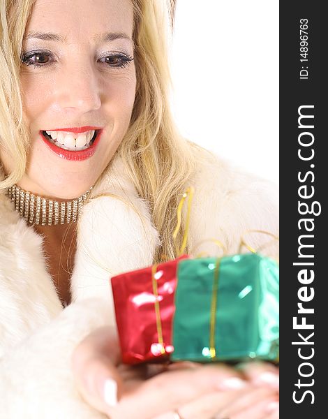Shot of a happy blonde holding presents vertical upclose
