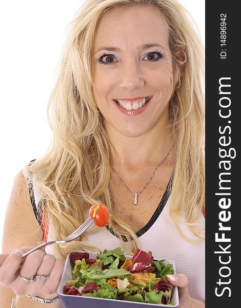 Shot of a woman eating a salad