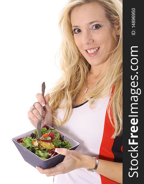 Shot of a Beautiful blonde eating a salad