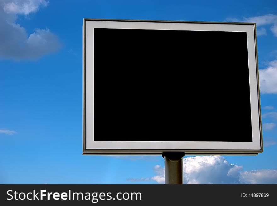 Blank black billboard over cloudy sky, prepared for your own design