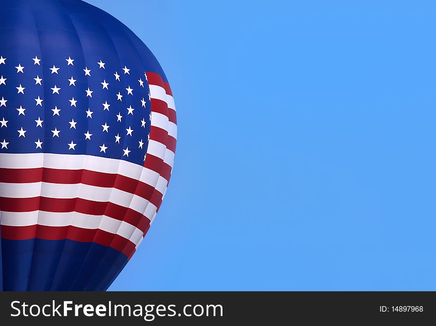 Hot air balloon in the sky with american flag design.
