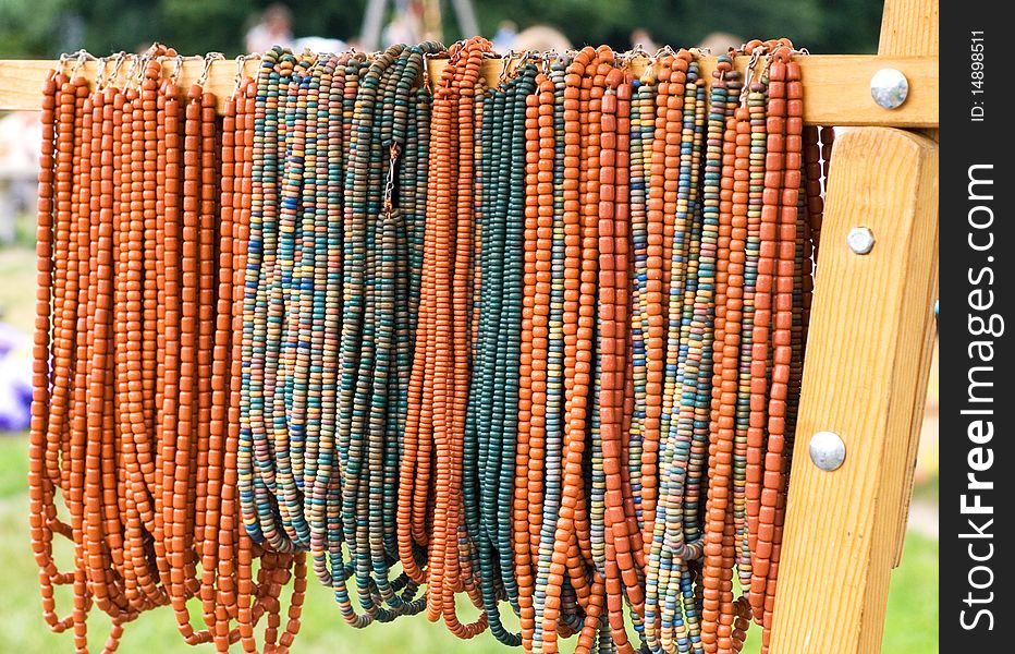The threads of coloured beads