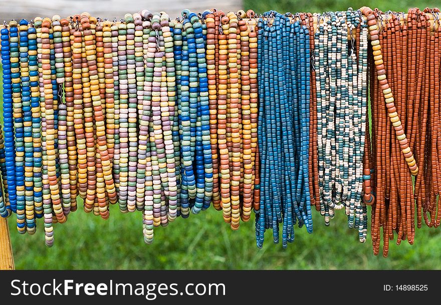 The threads of coloured beads